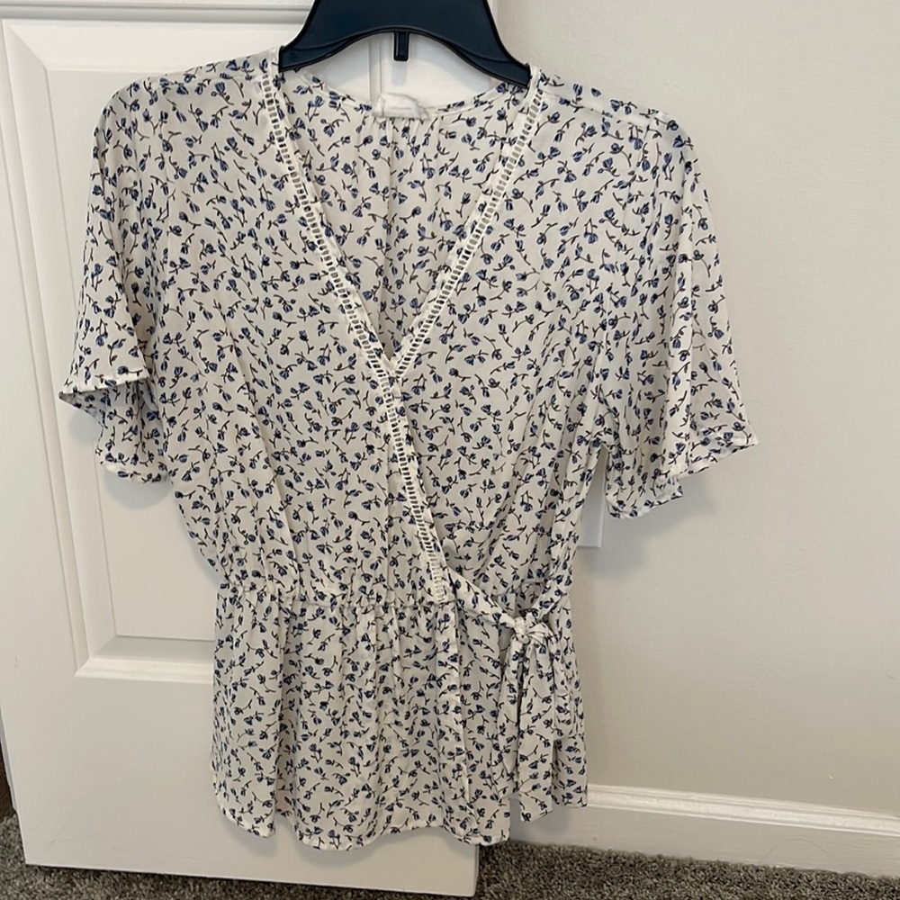 Blue flowered wrap tie blouse